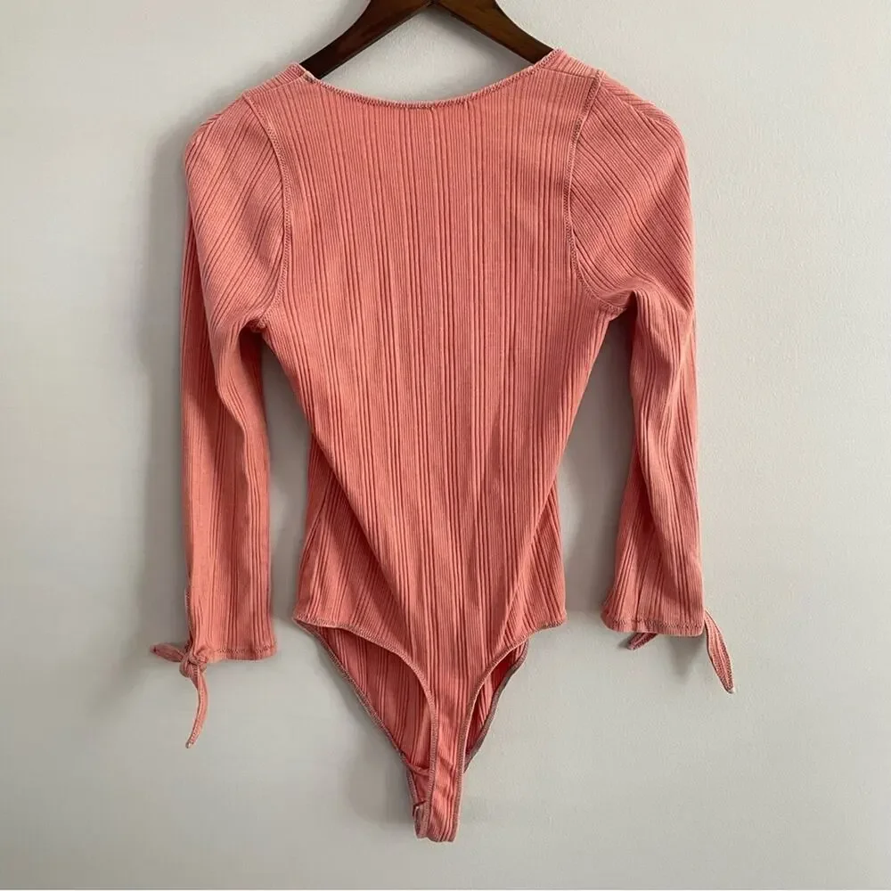 Free People | Women’s Move On Bodysuit Mooncake Pink Ribbed Long Sleeve Bow Cuff